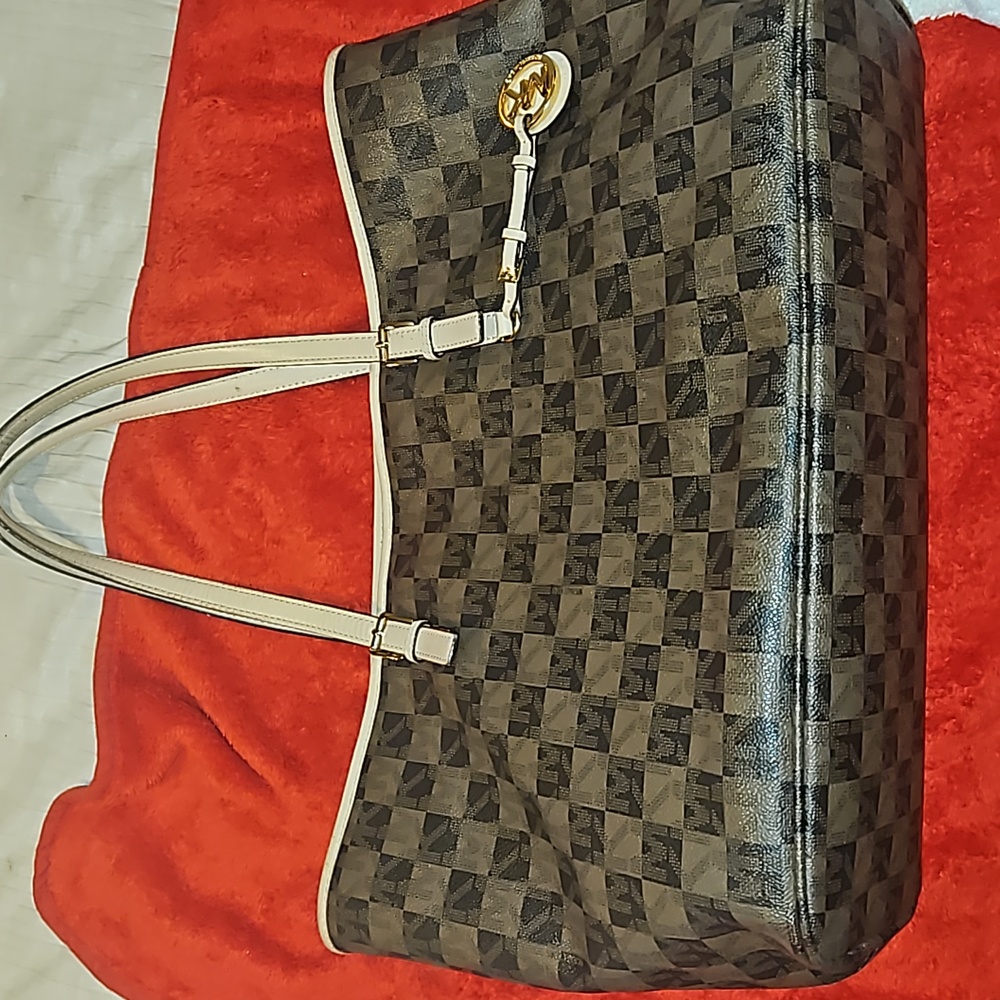 MK Brown checkard design purse.